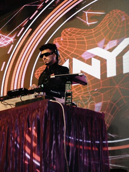 My name in lights, creating a concert-like atmosphere for this epic wedding gig. I bring a professional setup and a larger-than-life presence to make your event feel truly special.