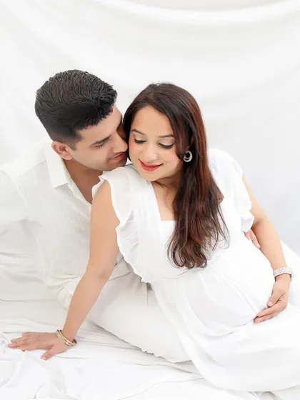 The beautiful beginning. This classic, all-white studio maternity session focuses on the pure love and quiet excitement between parents-to-be. A simple and timeless way to remember this special journey.