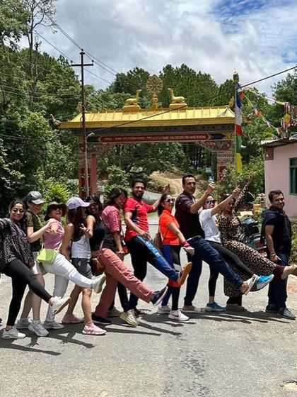 A playful moment at the entrance to the Namo Buddha Monastery. Our trek to this sacred site was challenging, but the sense of accomplishment and community made it all worthwhile.