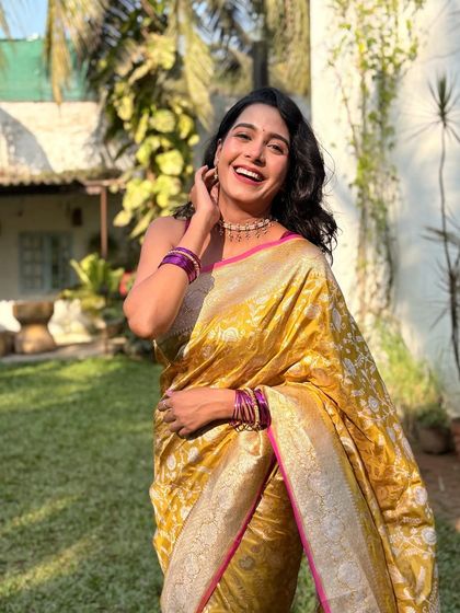 A joyful, laughing shot that captures the festive spirit of the song.