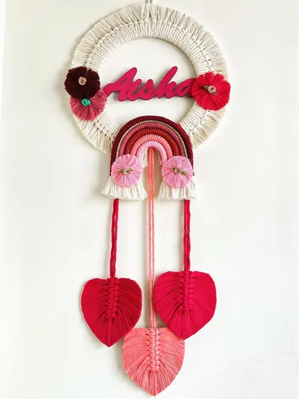 I adore making personalized gifts, and this name hanging for Aisha was a joy to create. Combining a custom nameplate with a rainbow and delicate macrame leaves makes for a perfect nursery decoration.