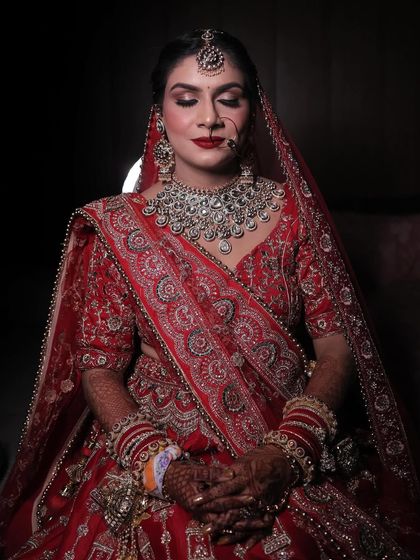 A moment of peace before the ceremonies begin. I gave my bride Himani a bold red lip and defined eyes for a powerful and elegant bridal look.