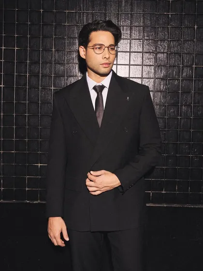 Another angle of Siddhant Chaturvedi's formal look. The styling is clean and minimal, letting the impeccable cut of the double-breasted jacket speak for itself.