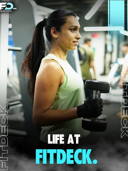 Life at FitDeck is about finding your focus and your strength. Here, a member demonstrates perfect form and concentration during a dumbbell workout.