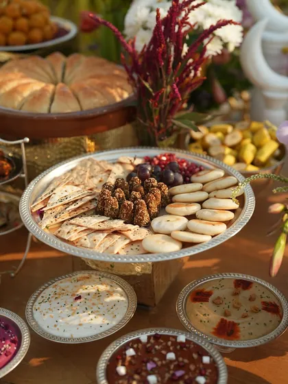 A platter of mini pitas, crackers, and kebabs, part of the extensive Mezze spread.