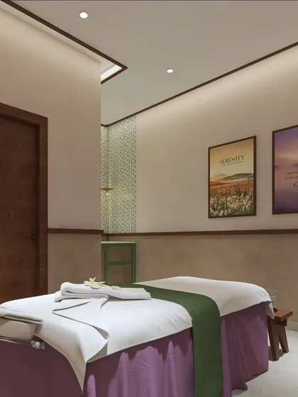 This treatment room is designed for tranquility and function. The layout provides ample space for the therapist to work, while the soft lighting and serene artwork help the client relax completely.