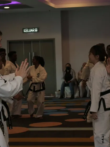 Partnering with another instructor for a hands-on drill. We practice techniques on each other to understand their real-world application.