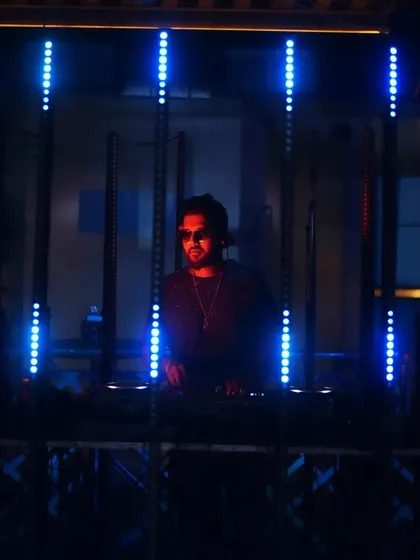A duplicate of the focused shot framed by blue lights.
