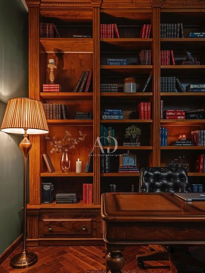 A wider view of the study, highlighting the classic wooden desk and leather chair. The design is a nod to traditional British interiors, creating a space that feels both timeless and deeply personal.