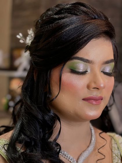A close-up of the green eyeshadow look, showing the seamless blending and shimmer.
