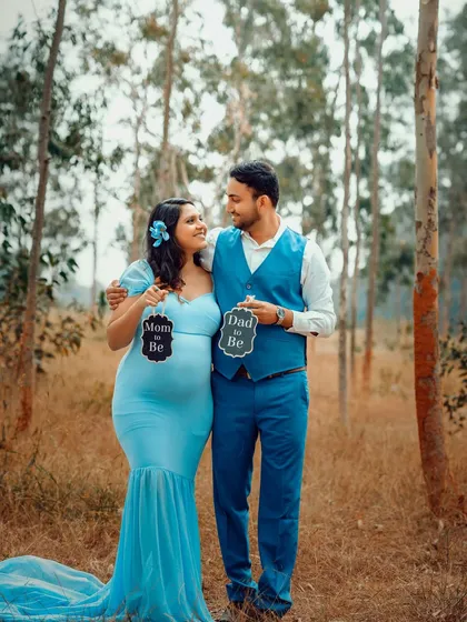 Let's take our session outdoors. I help couples find the perfect natural backdrop in Bangalore for their maternity photos, creating a relaxed and beautiful setting to capture your story, just like this one.