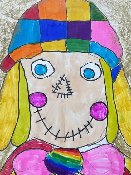 A colorful and friendly scarecrow face. This drawing shows a wonderful use of pattern and bright colors to create a cheerful character.