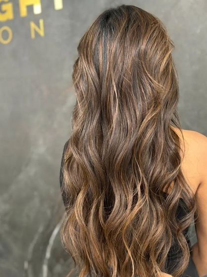 A side view of the gypsy soul balayage, showing its length and flow.