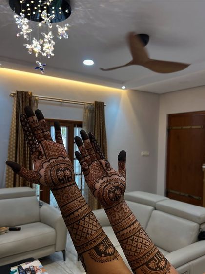 A full-arm bridal design captured in a home setting, showing that I travel to my clients for their comfort.
