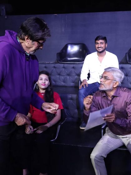 This photo is so special to me. It's my dad presenting my work to Amitabh Bachchan. My family's support is a huge part of my artistic journey.