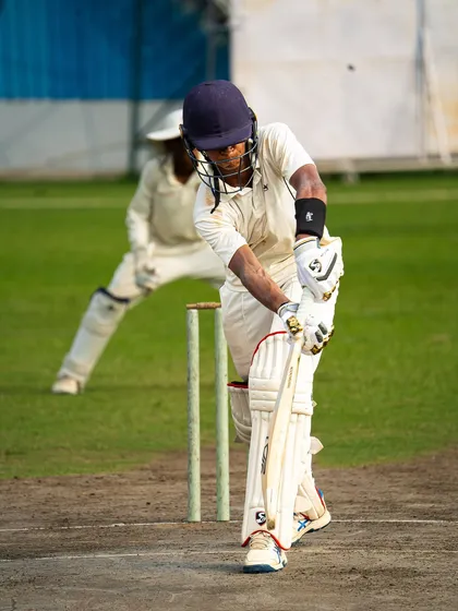 A batsman shows solid defensive technique, playing the ball right under his eyes. Mastering both attack and defense is crucial, and our tour matches provide the platform to practice both.