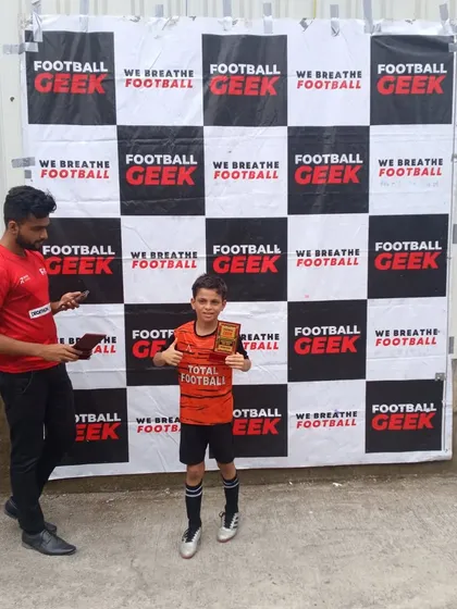 A player receives his award for being a standout performer.