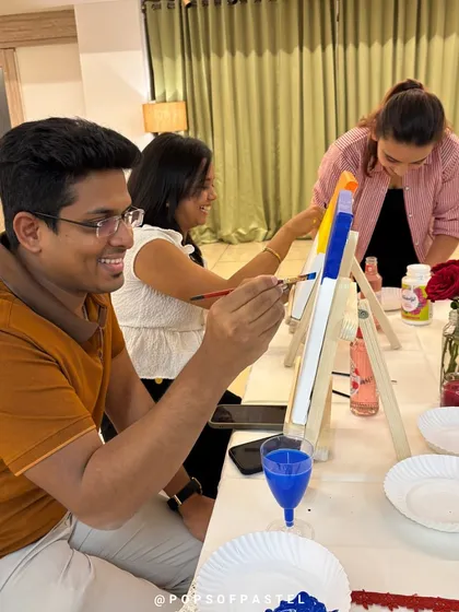 A candid shot of a couple enjoying the painting process together during our Valentine's event.
