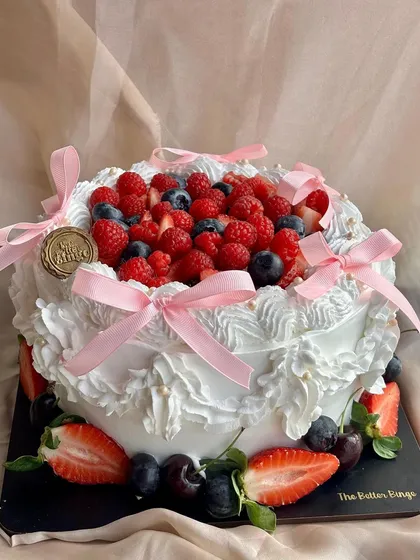 Another angle of our beautiful Vanilla & Berries cake. The combination of light vanilla sponge and tart berries is a crowd-pleaser for any event.