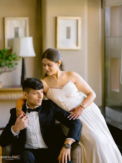 A tender, yet posed portrait that exudes sophistication. Her hand on his shoulder, their soft expressions, it's a picture of gentle, elegant love.