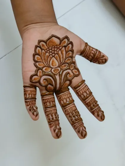 This is the mehndi design right after the paste has been removed. The initial color is a bright orange.