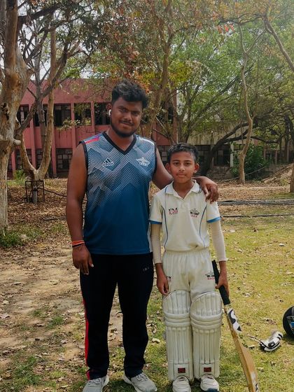 Here I am with 11-year-old Ayush Neupane after he played a brilliant inning of 154 runs. It's amazing to see such young talent perform with so much confidence.