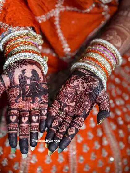The final stain is the most important part. This photo shows the deep, rich maroon color my natural henna achieves, featuring detailed couple portraits that look stunning against the dark stain.