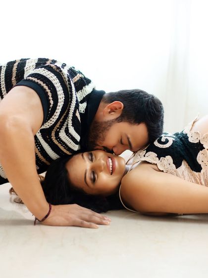 A playful and romantic pose idea. Lying down and sharing a sweet moment creates a very different and intimate feel for your maternity photos.