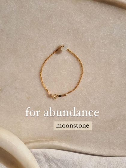 This delicate bracelet features a Moonstone charm, a stone for abundance and new beginnings. It's a simple piece for everyday wear.