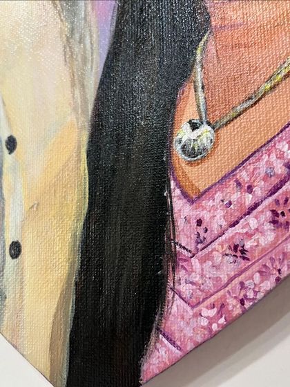 A close-up detail of a commissioned couple's portrait on a heart-shaped canvas. I focused on capturing the texture of the clothing and the warmth of their connection.