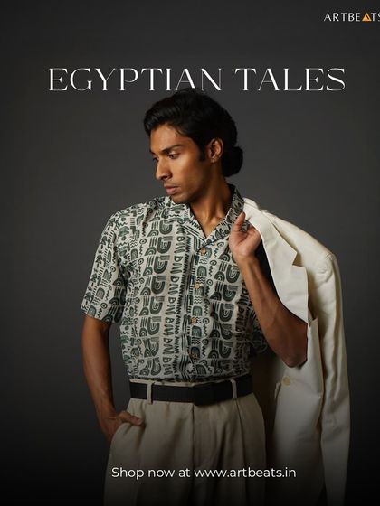 The Egyptian Tales men's shirt. This piece features a unique, hieroglyphic-inspired pattern, turning a classic short-sleeve shirt into a wearable story of ancient history.