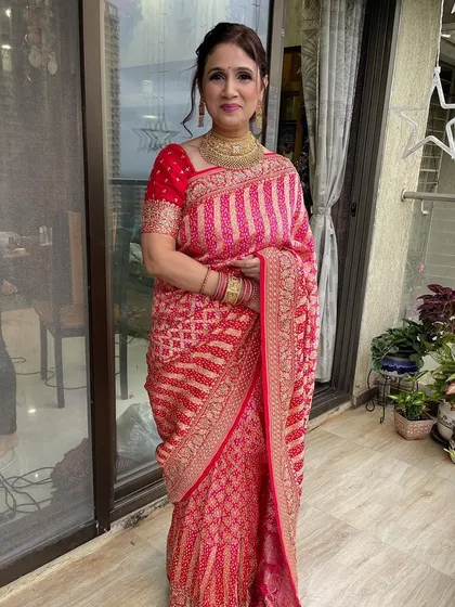 The full look for this elegant client. The makeup is refined and beautiful, perfectly complementing her traditional attire.