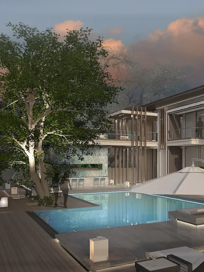 A view of the poolside deck, where the architecture provides a stunning backdrop for outdoor living. This space is designed as a work of art in itself, a place to relax and appreciate the harmony between the home and its natural setting.