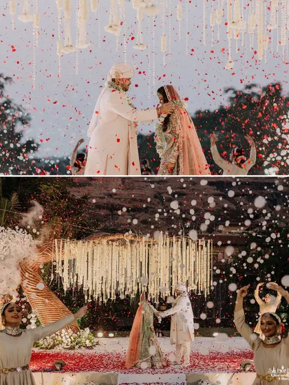 The varmala exchange, a pivotal moment in any Indian wedding. This ceremony was framed by dancers and a shower of red and white petals, making it a picture-perfect memory.