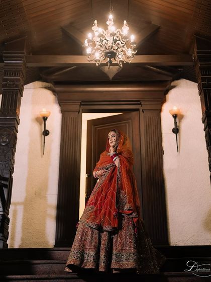 An architectural shot with the bride looking majestic. The lighting beautifully highlights her features and the stunning makeup.