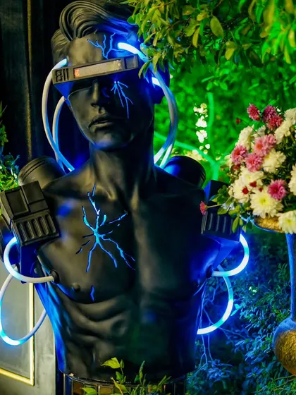 A close-up of a cyberpunk-inspired bust with neon lighting, one of the many unique details we use to bring a theme to life.