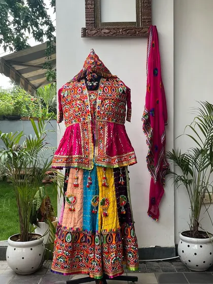 Another stunning option for men, this set features a pink Kedia top and a colorful skirt. Perfect for coordinating with a partner.