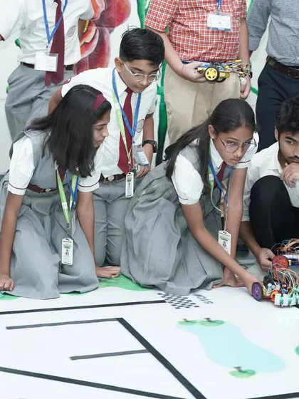 A student from our program focuses intently during the Robotics Championship held at IIT Delhi. We provide platforms for young innovators to test their skills on a national stage.