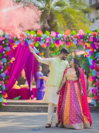 For Prachi and Sandeep's vibrant Mehendi, we used a smoke bomb to create this energetic and colorful shot. It's all about capturing the fun and excitement of your pre-wedding celebrations in a dynamic way.
