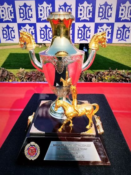 The ornate Madras Race Club Trophy, featuring golden horse-head handles.