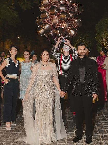 For this Parisian-themed cocktail night, the couple's entry was accompanied by mimes and performers, immediately immersing guests in the romantic, whimsical streets of Paris.