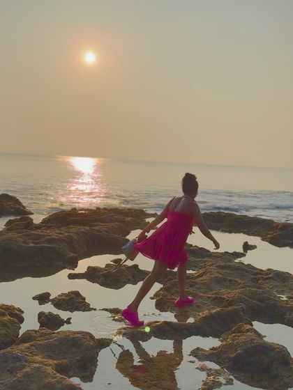 Stretching by the sea at sunset in the Andamans. Functional fitness means being able to move freely and comfortably in any environment.