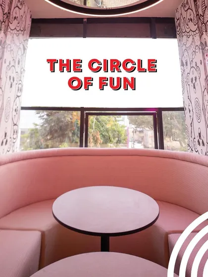 Welcome to the circle of fun. This photo showcases our cozy and stylish booth seating, a perfect spot for parents to enjoy a conversation and some yummy food while the kids play.