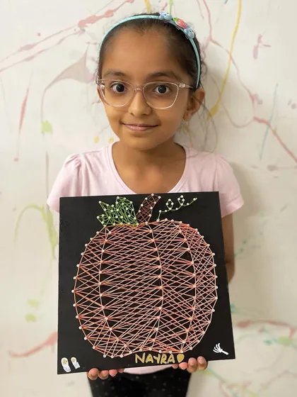 Another fantastic Halloween pumpkin string art, personalized with the artist's name.