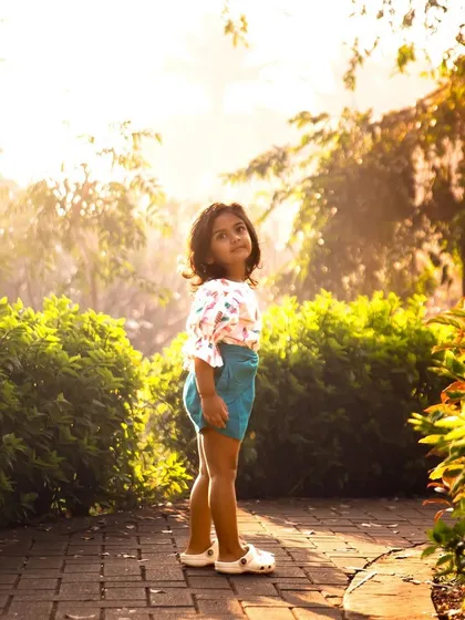 Innocence and wonder, captured forever in the golden light of the evening. This image is from a series celebrating her third birthday, documenting her personality at this precious age.