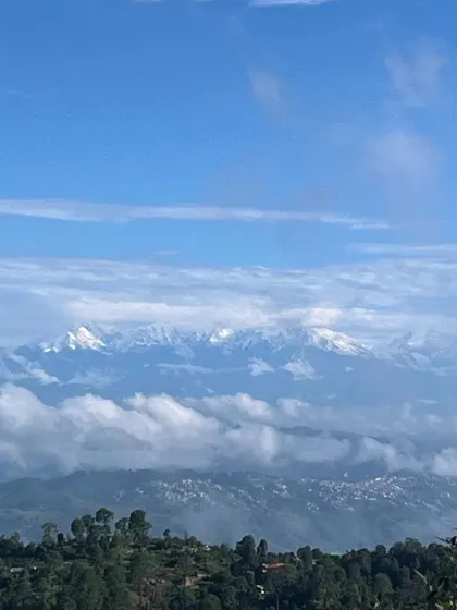 A clear day offers breathtaking views of the distant Himalayan range, a powerful reminder of the grandeur of nature.
