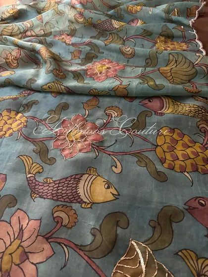 This image focuses on the charming, hand-painted fish motifs, each one unique, swimming amongst floral vines in a serene aquatic scene.