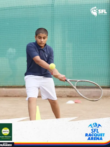 Learning the fundamentals of a forehand volley. This young player is practicing near the net, a key skill for controlling the court in doubles and singles play.