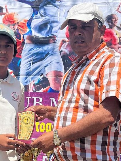 Nishant receiving the Man of the Match award after a championship-winning performance.
