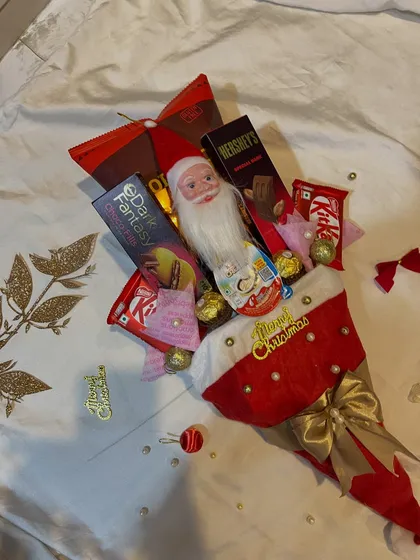 Another angle of the Christmas bouquet, showing how it's packed with a variety of popular chocolates like KitKat and Hershey's.